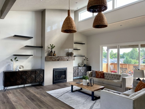 Living room with hardwood flooring, fireplace, and modern decor