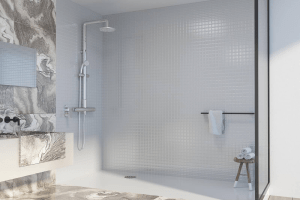 Modern tile shower with elegant gray and white marble accents, featuring a sleek showerhead, minimalist design, and a curbless entry, reflecting contemporary bathroom renovation trends.