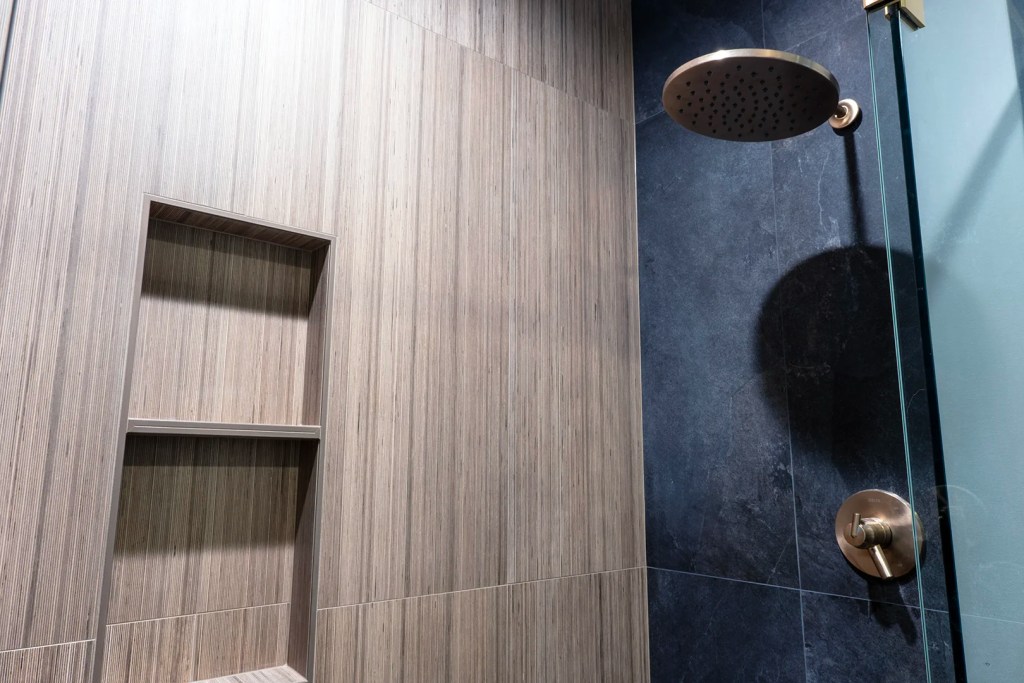 Walk-in tile shower with recessed niches and rainfall showerhead in Salem bathroom